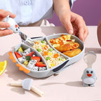 Set diversificare bebelusi din silicon, 1 farfurie compartimentata in forma de pinguin, lingurita si furculita, pai, perie pai, fara alergeni, ventuza fixare, gri